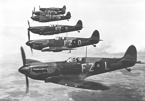 Spitfires in formation above the English countryside during World War 2