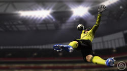 A goalkeeper stretching for a ball in FIFA Soccer 11