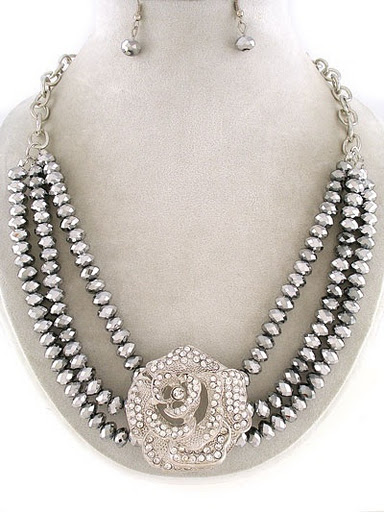 http://imagehost.vendio.com/preview/a/35111061/aview/Silver_252520rose_252520bead_252520neck.jpg