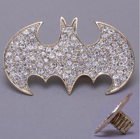 http://imagehost.vendio.com/preview/a/35111061/aview/batman_ring_crystal_gold.jpg