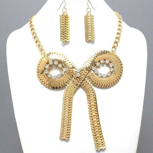 http://imagehost.vendio.com/preview/a/35111061/aview/gold_2520bow_2520necklace.jpg