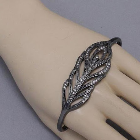 http://imagehost.vendio.com/preview/a/35111061/aview/hand_feather_cuff.jpg