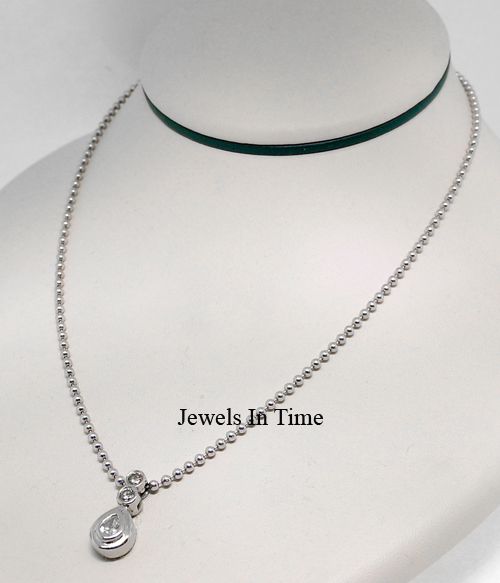 Near mint ladies necklace features a white gold pendant with 3 ...