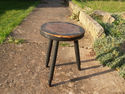 Early 20th Century ebonised milking stool with sta