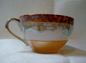 UNMARKED LUSTERWARE CUP WITH HOUSE AND PALM TREE D