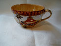 UNMARKED LUSTERWARE CUP WITH HOUSE AND PALM TREE D