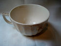 VINTAGE UNMARKED COFFEE/TEA CUP BEIGE WITH GOLD PA