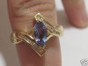 FINE 1.25 CT MARQUISE TANZANITE AND DIAMOND RING 1