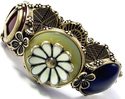 ANTIQUED GOLD LUCKY PEACE FLOWER CHARM CUFF BRACEL