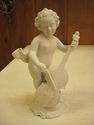 Set of Four Bisque Cherub Figurines with Instrumen