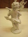 Set of Four Bisque Cherub Figurines with Instrumen