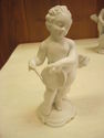 Set of Four Bisque Cherub Figurines with Instrumen