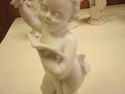 Set of Four Bisque Cherub Figurines with Instrumen