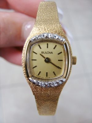 Avon Treasures : BULOVA LADIES GOLD TONE WRIST WATCH WITH DIAMONDS