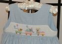 Custom-made hand smocked teddy bear train wrap dre