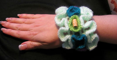 A HANDMADE CROCHETED BRACELET WITH WOODEN BEADS ON