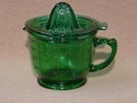 GREEN TWO-PIECE MEASURING CUP AND JUICER/REAMER 