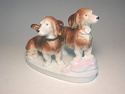 German porcelain 2 DACHSHUND dogs step on pink pil