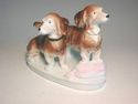 German porcelain 2 DACHSHUND dogs step on pink pil