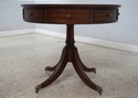 L67976: ETHAN ALLEN Round Mahogany Leather Top Dru