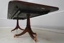 L66493: MAITLAND SMITH Crotch Mahogany Dining Tabl