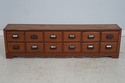 F74251: Antique 12 Drawer Oak Apothecary Cabinet