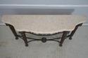 69626: MAITLAND SMITH Travertine Top Bronze Consol