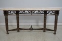69626: MAITLAND SMITH Travertine Top Bronze Consol