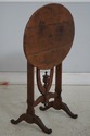 75523: DON RUSEAU Distressed Finish Tilt Top Table