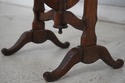75523: DON RUSEAU Distressed Finish Tilt Top Table