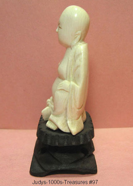 small carved ivory buddha