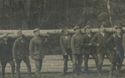 RPPc German Men Carry Huge Logs On Their Shoulders