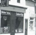 RPPC:DELAFIELD WI MAIN ST ZUNKERS BAR BEER OLD CAR